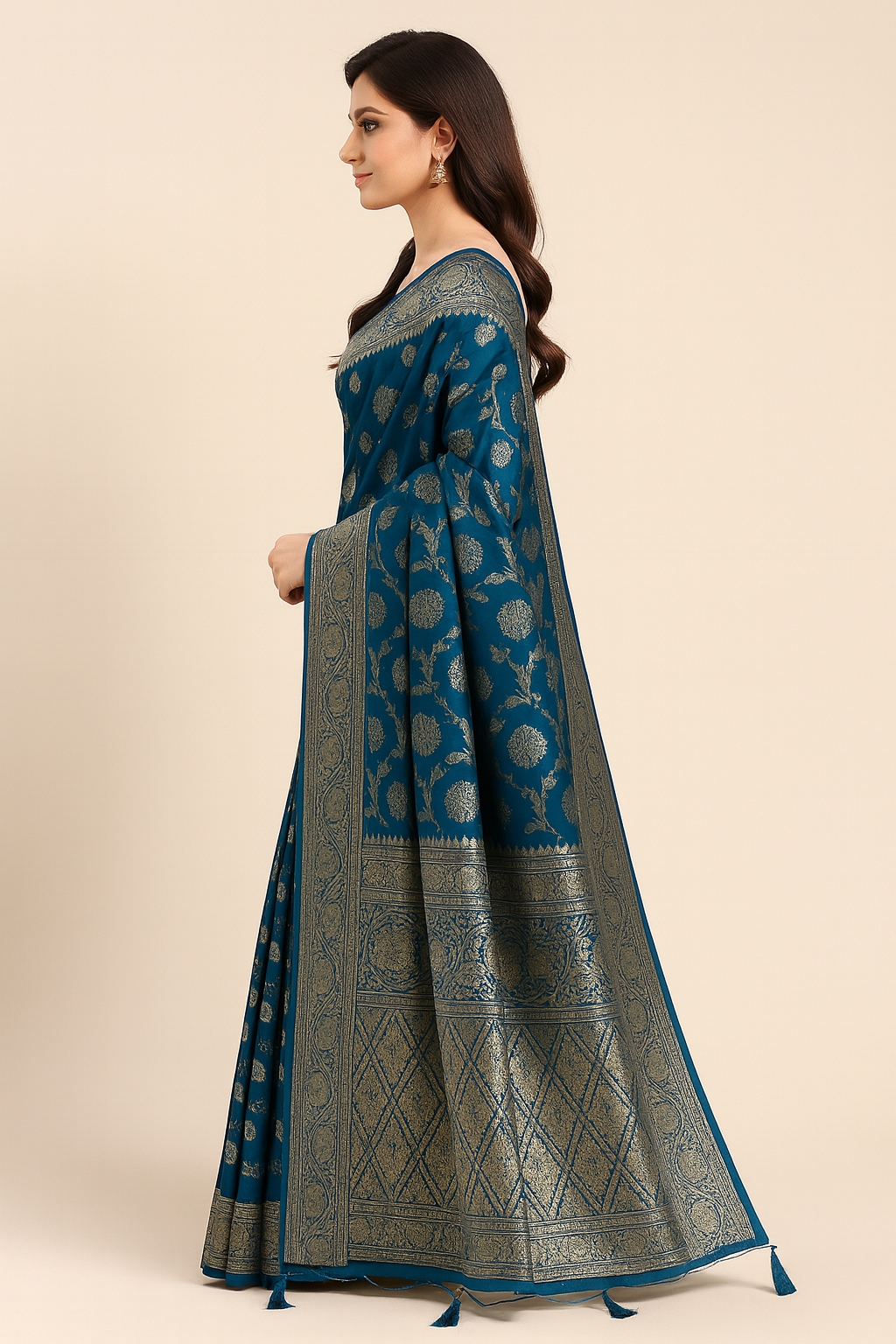 Elegant teal-blue saree with golden zari work, perfect for celebrations.